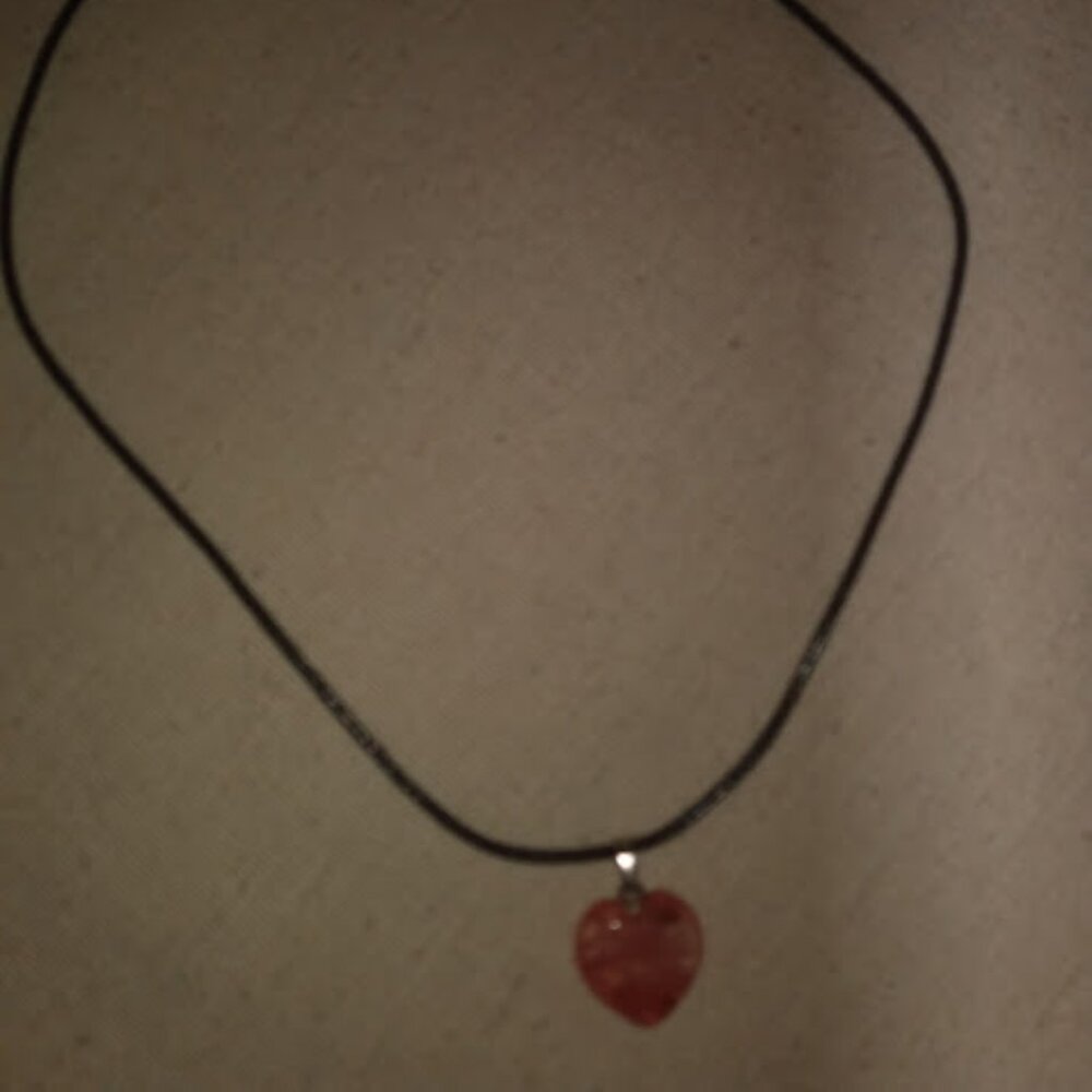 Orange color heart shaped stone pendant necklace.